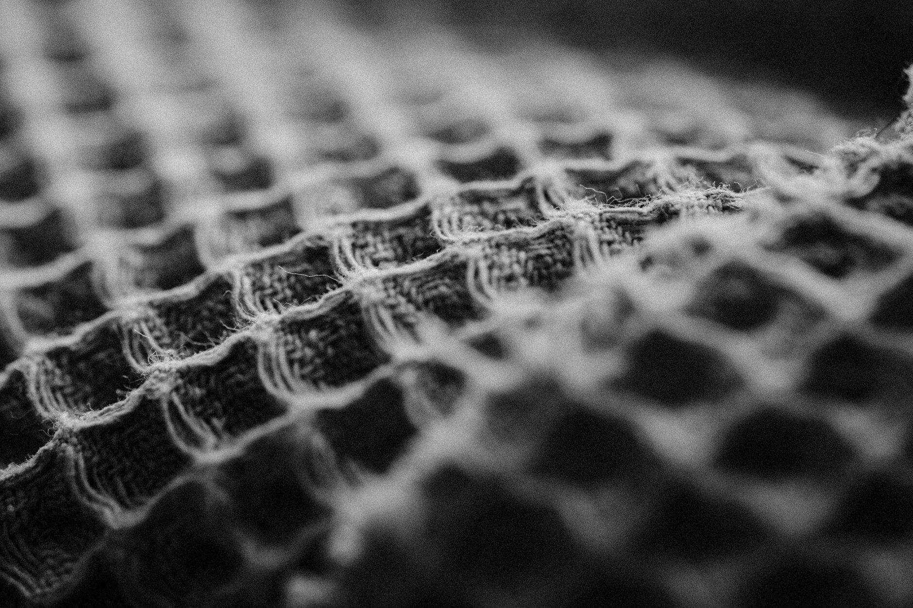 Close-up of high-quality, tactile home materials like linen and wool.