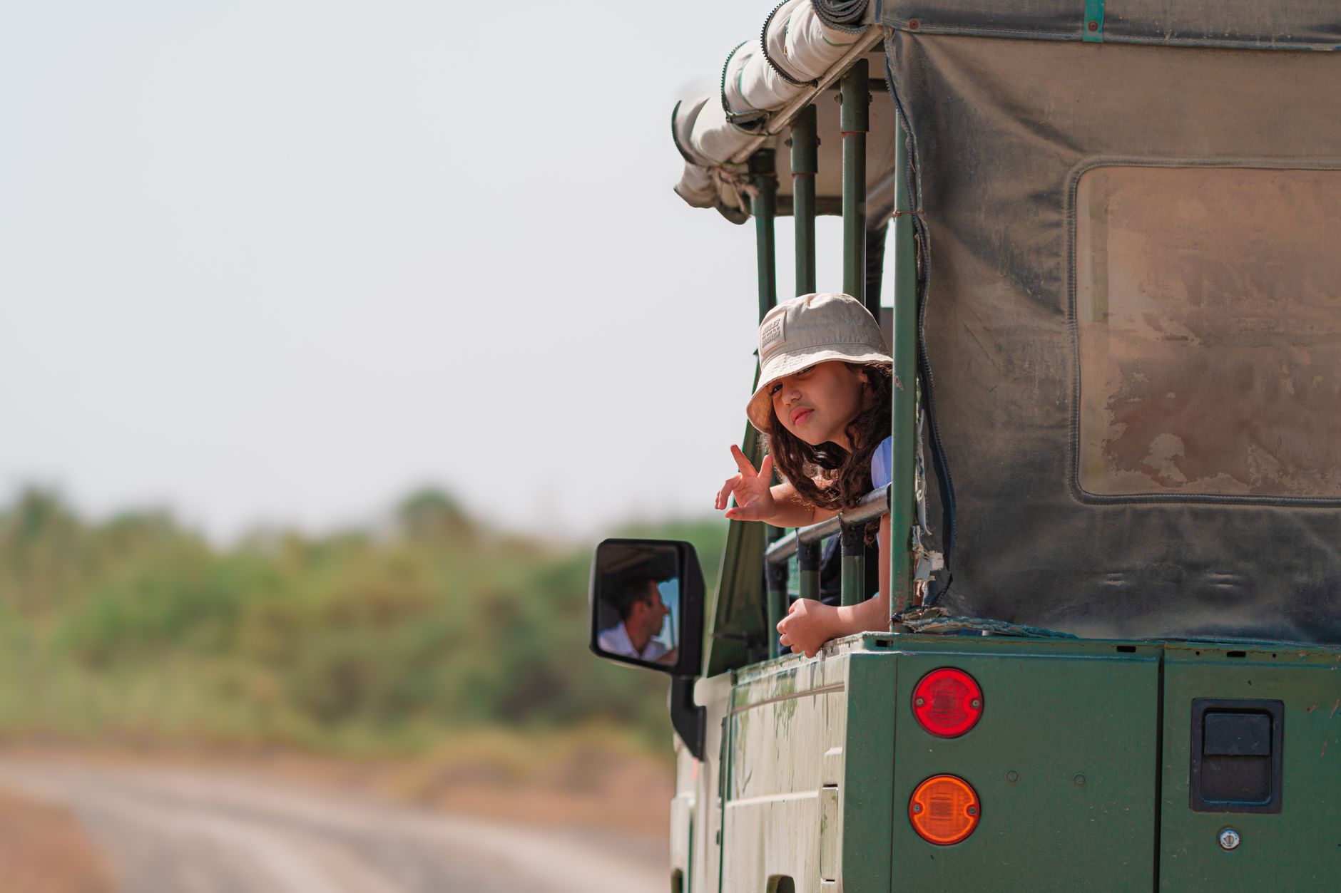 A child engaging with nature during a slow travel trip.