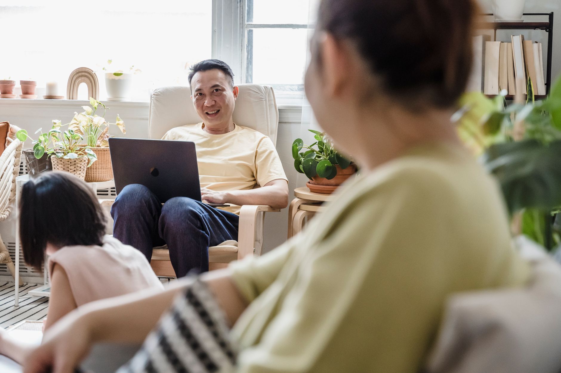 Parents interacting in a community space, symbolizing the social aspect of Universal Basic Services.