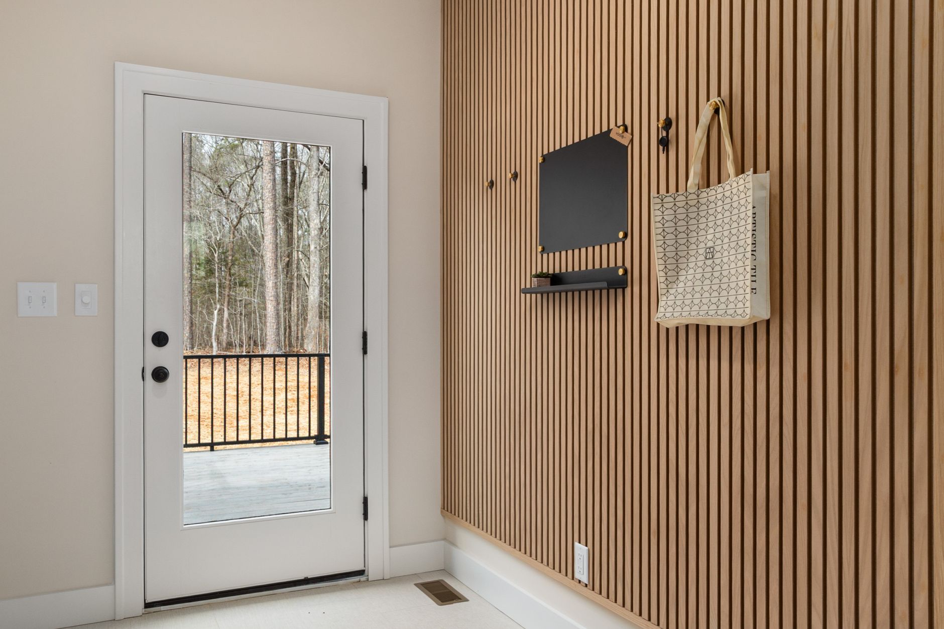 A clutter-free, functional, and elegant entryway for a busy family.