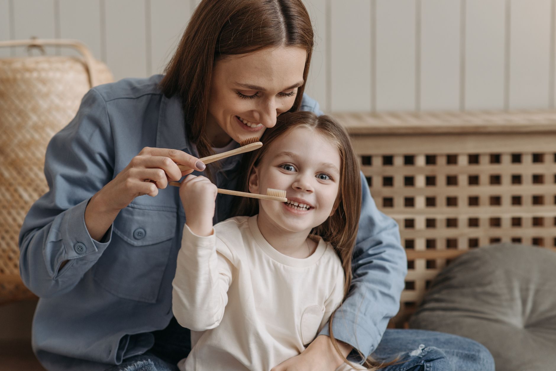A parent and child engaging in sustainable home habits.