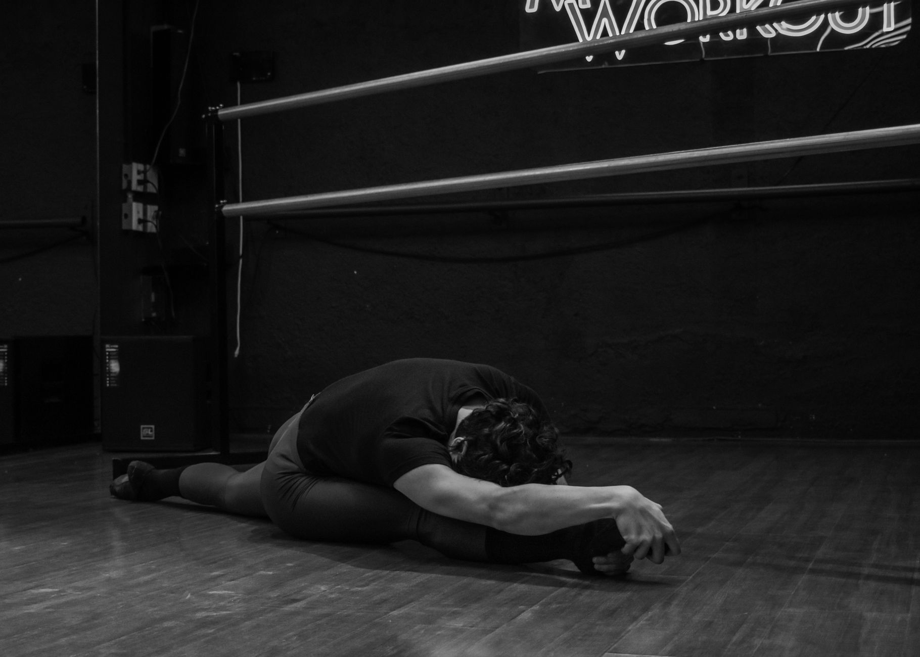 Individual performing light evening stretches for muscle relaxation.