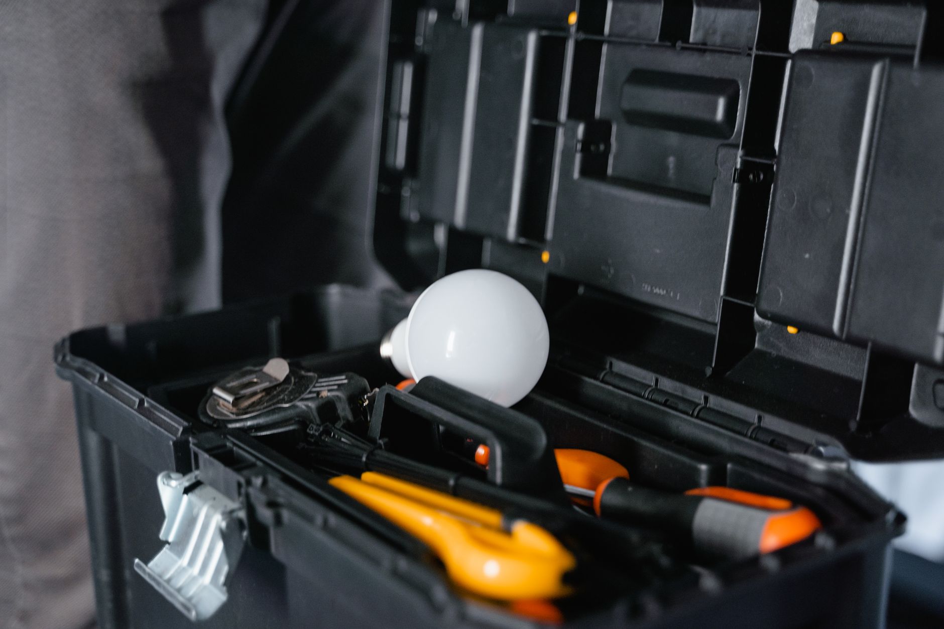 A well-organized shelf featuring essential DIY home repair tools.