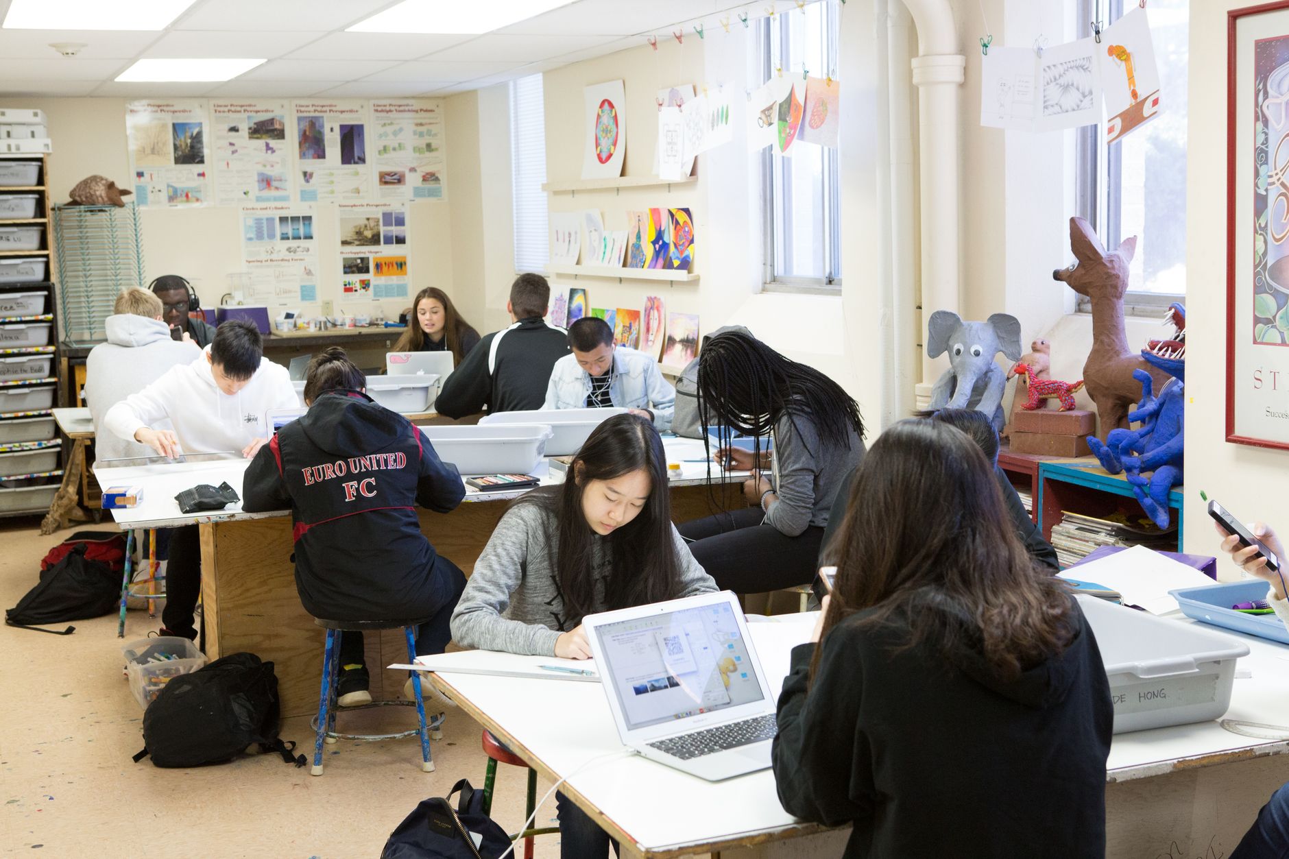 Students working together on a collaborative school project.