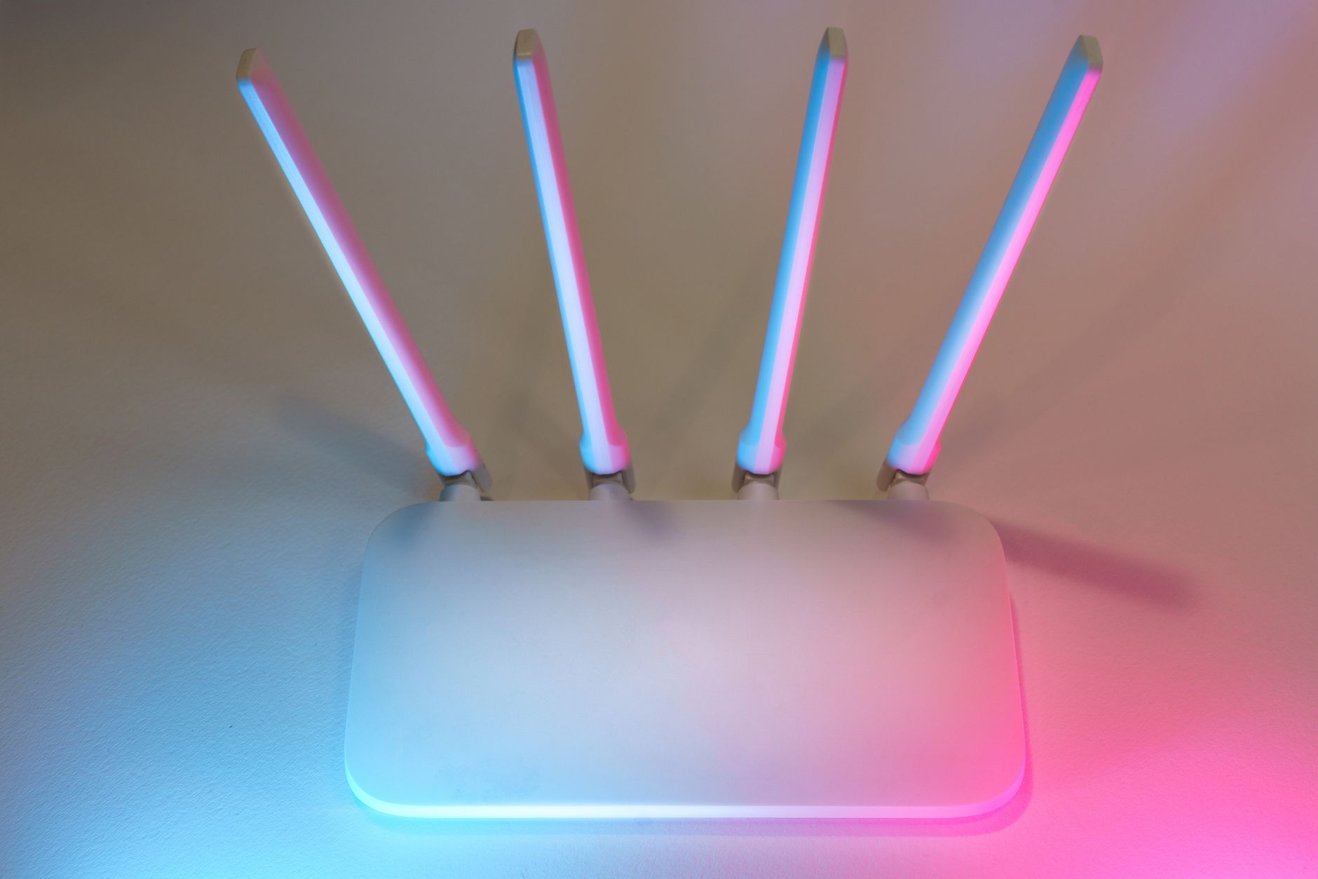 Detailed close-up of a modern Wi-Fi router with multiple antennas.