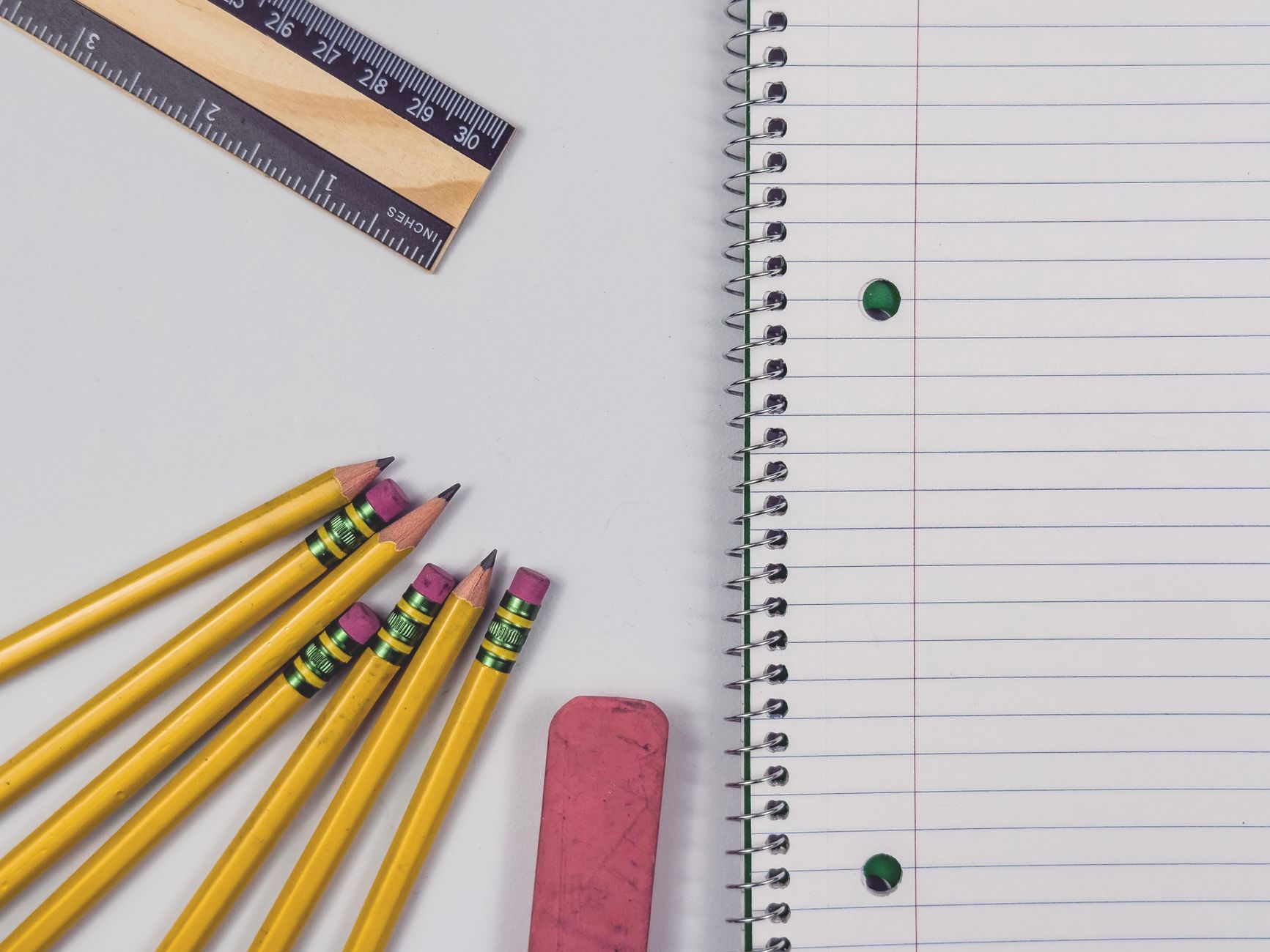 A flat-lay of essential travel items for an educational family vacation.