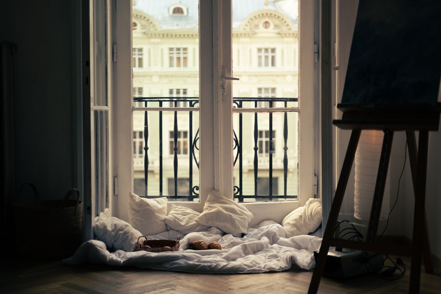 A cozy outdoor reading corner on a balcony.