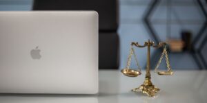 A modern laptop on a desk representing the balance between work and family life.
