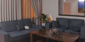 A cozy, modern living room setting representing the intersection of family life and digital technology.
