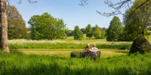 A family enjoying a quiet moment in a scenic valley, representing the essence of slow travel.