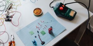A organized workspace for repairing various household electronics.