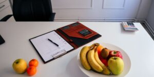 A clean, modern workspace featuring healthy habits tools for busy parents.