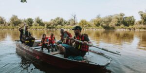 A family enjoying a safe adventure travel experience in the mountains.