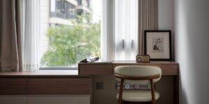 A clean, modern home office space with a window view, perfect for remote work and family planning.