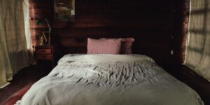 A peaceful, dimly lit bedroom interior designed for relaxation.