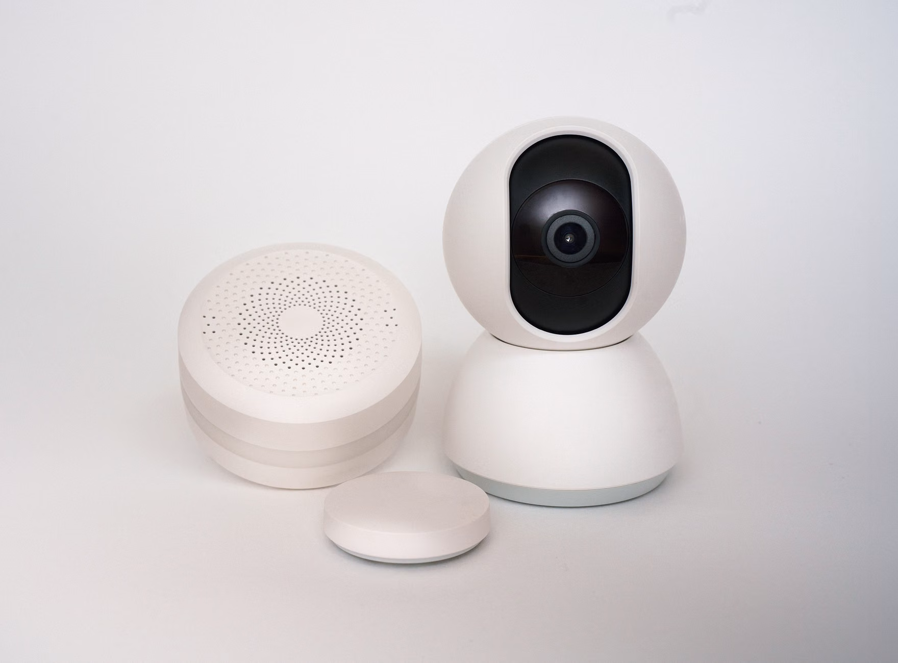 Wireless smart door sensor using adhesive mounting.