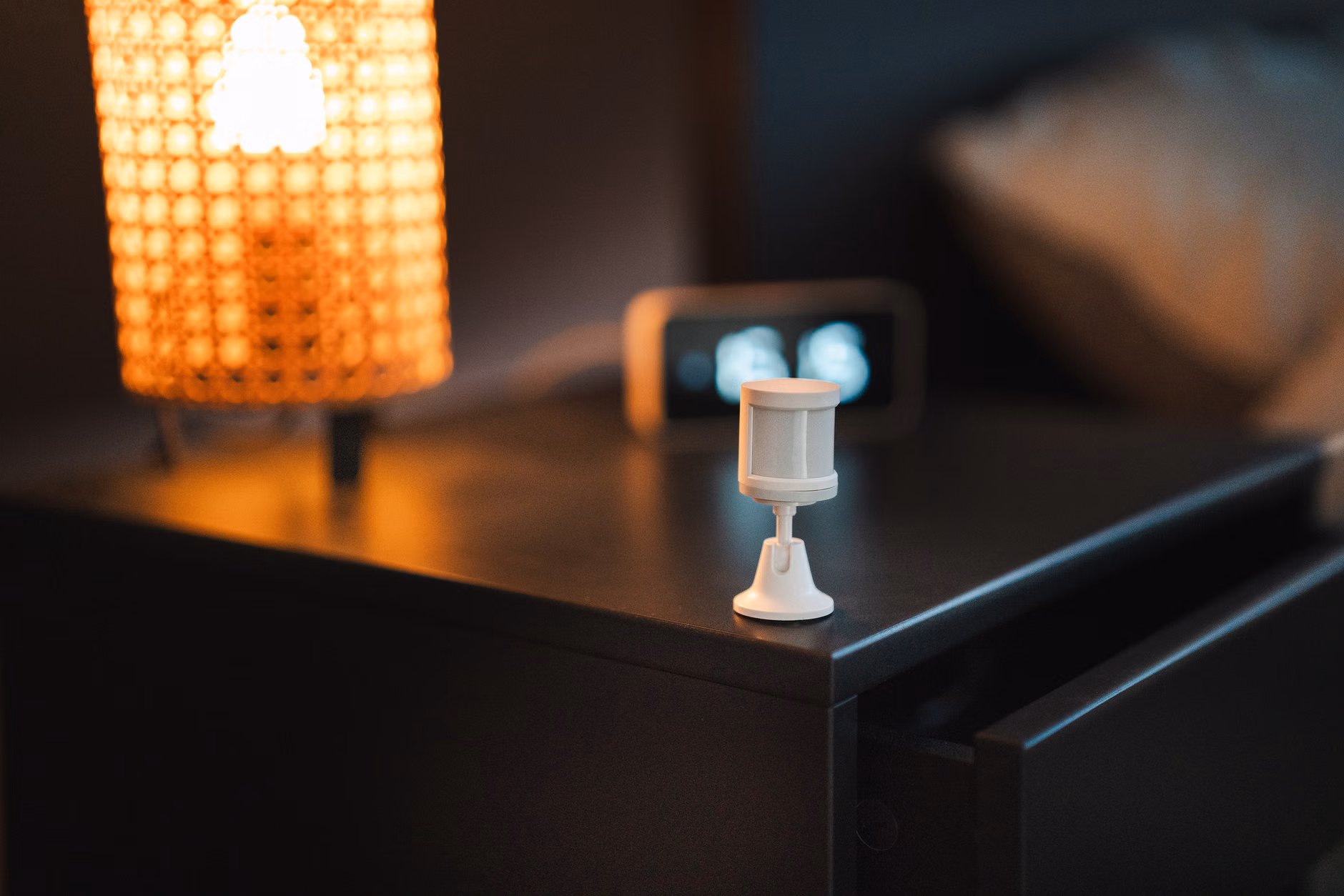 Smart home lighting setup on a nightstand.