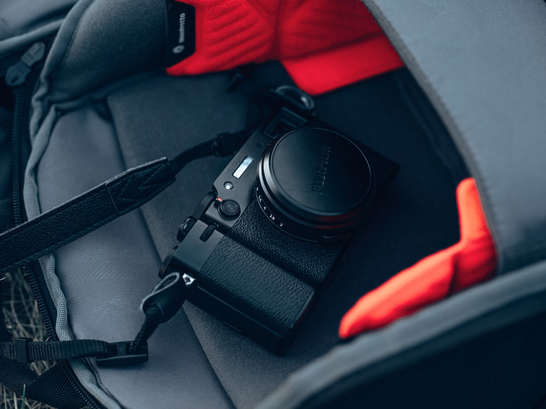 A neatly packed hiking backpack showing organized gear compartments.