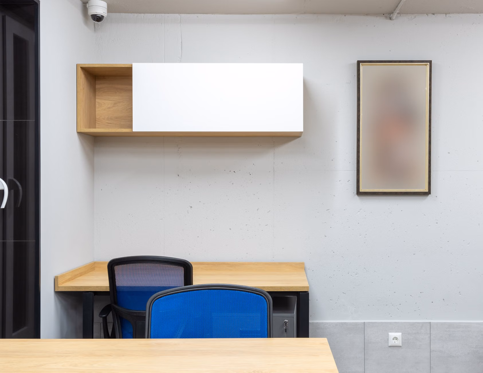 Modular wall-mounted desk system with clean organization.