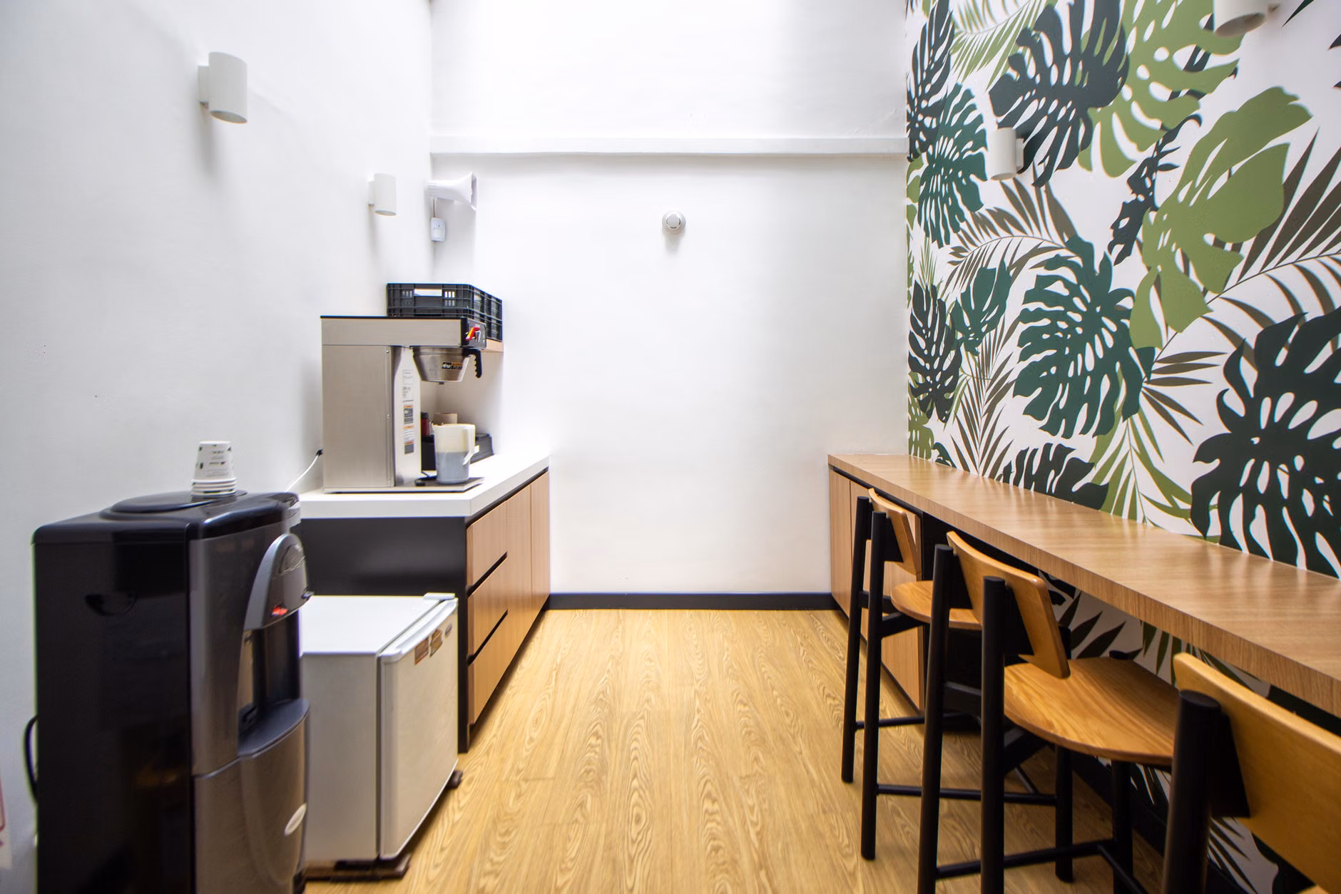 Modern co-working space with an adjacent child-friendly play zone.