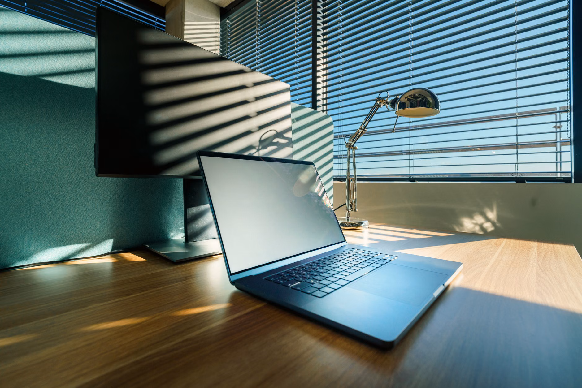 A desk showing the intersection of remote professional work and family life.