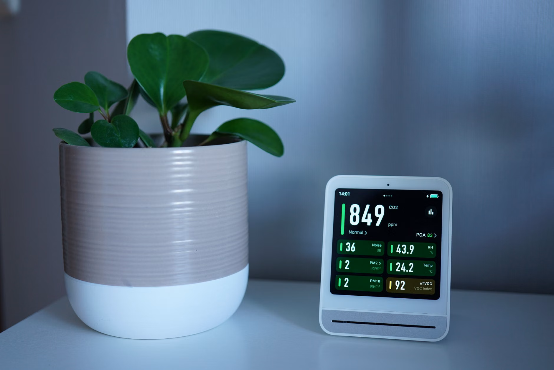 Digital energy monitor displaying household power usage.