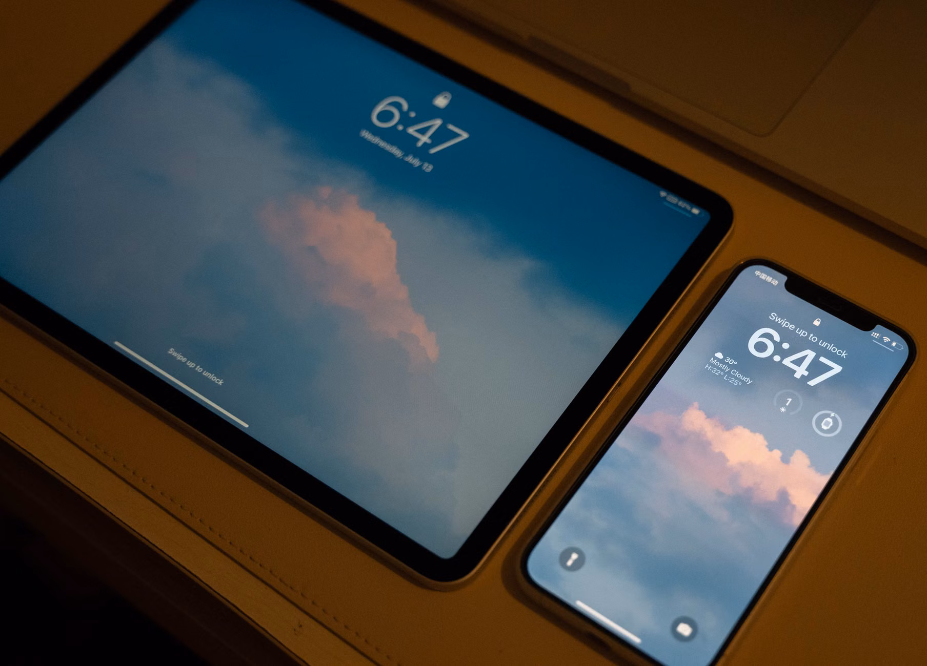 Two parents syncing their digital calendars on different devices.