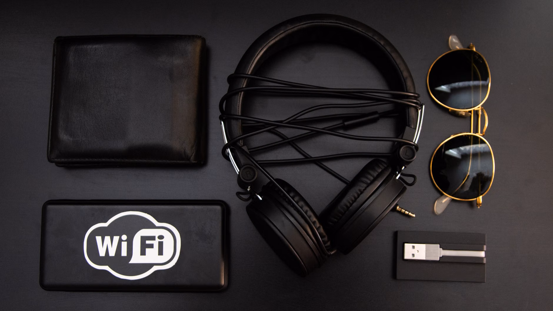 An organized tech pouch with charging cables and headphones for travel.