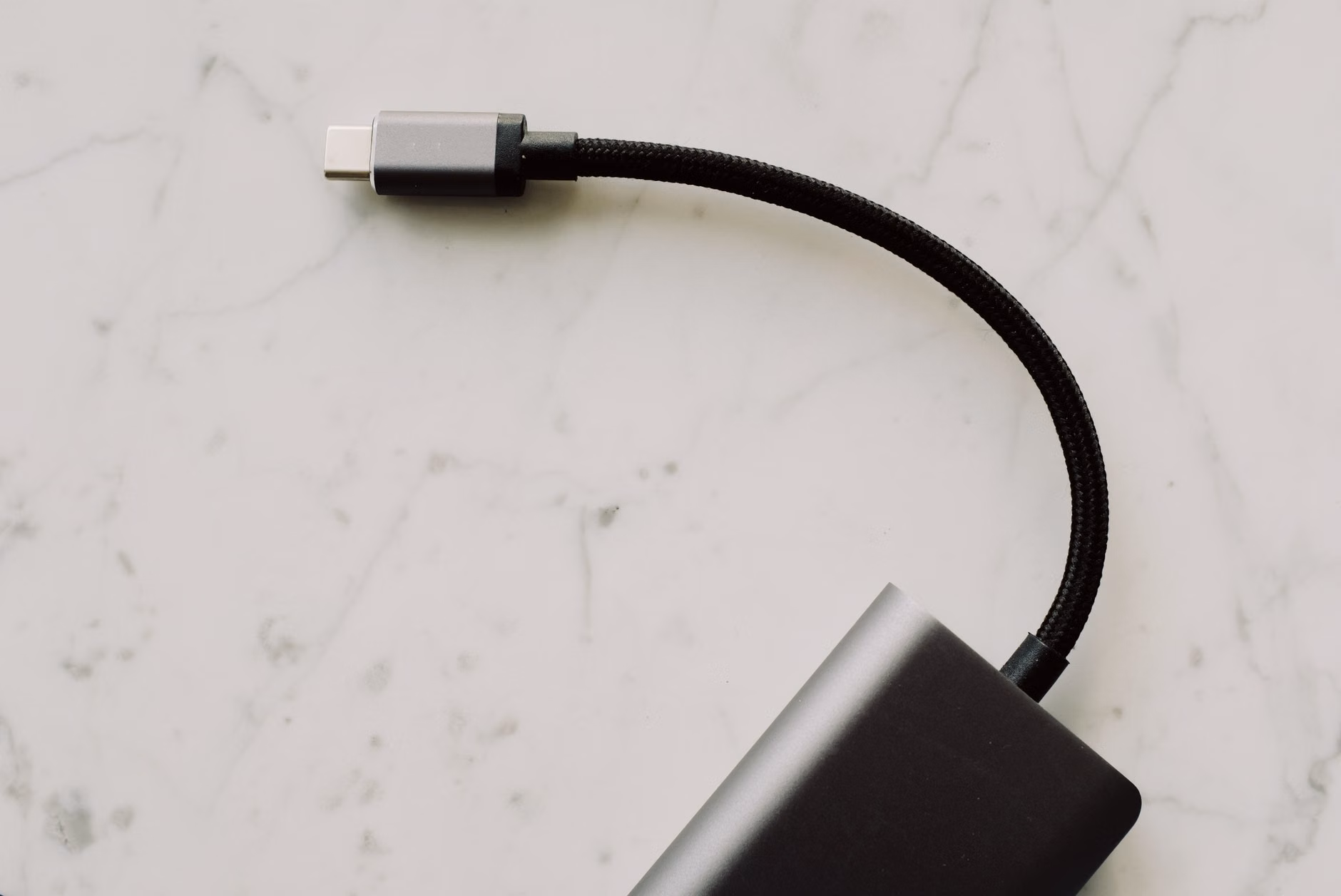 Comparison of a messy cable drawer versus an organized USB-C cable setup.