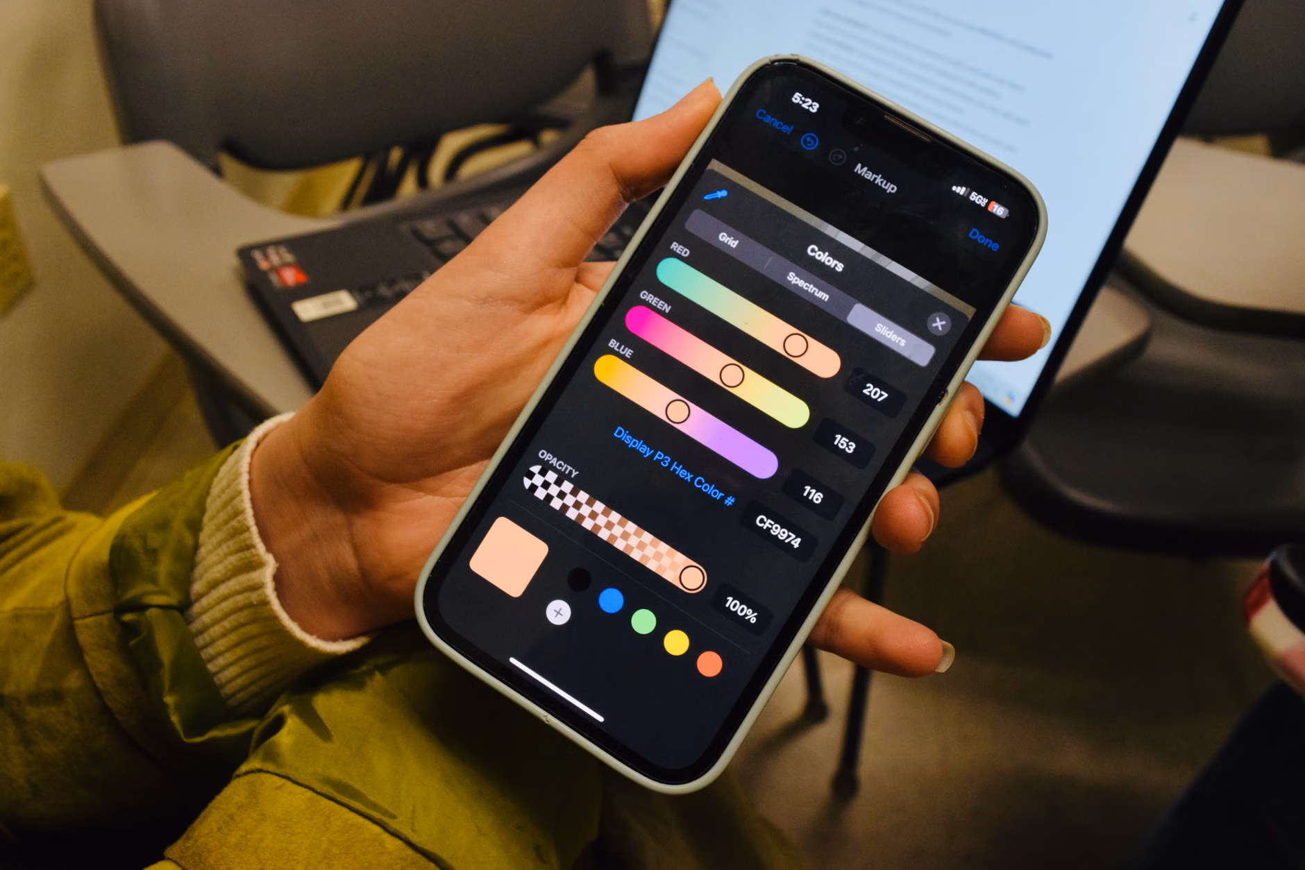 A person adjusting privacy settings on their smartphone in a home setting.