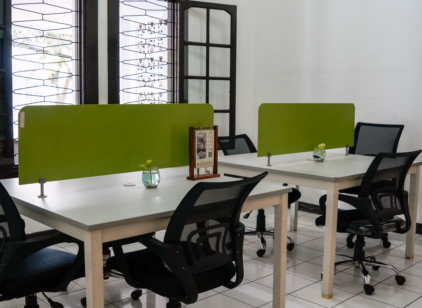 A professional working in a quiet, ergonomic neighborhood co-working hub.