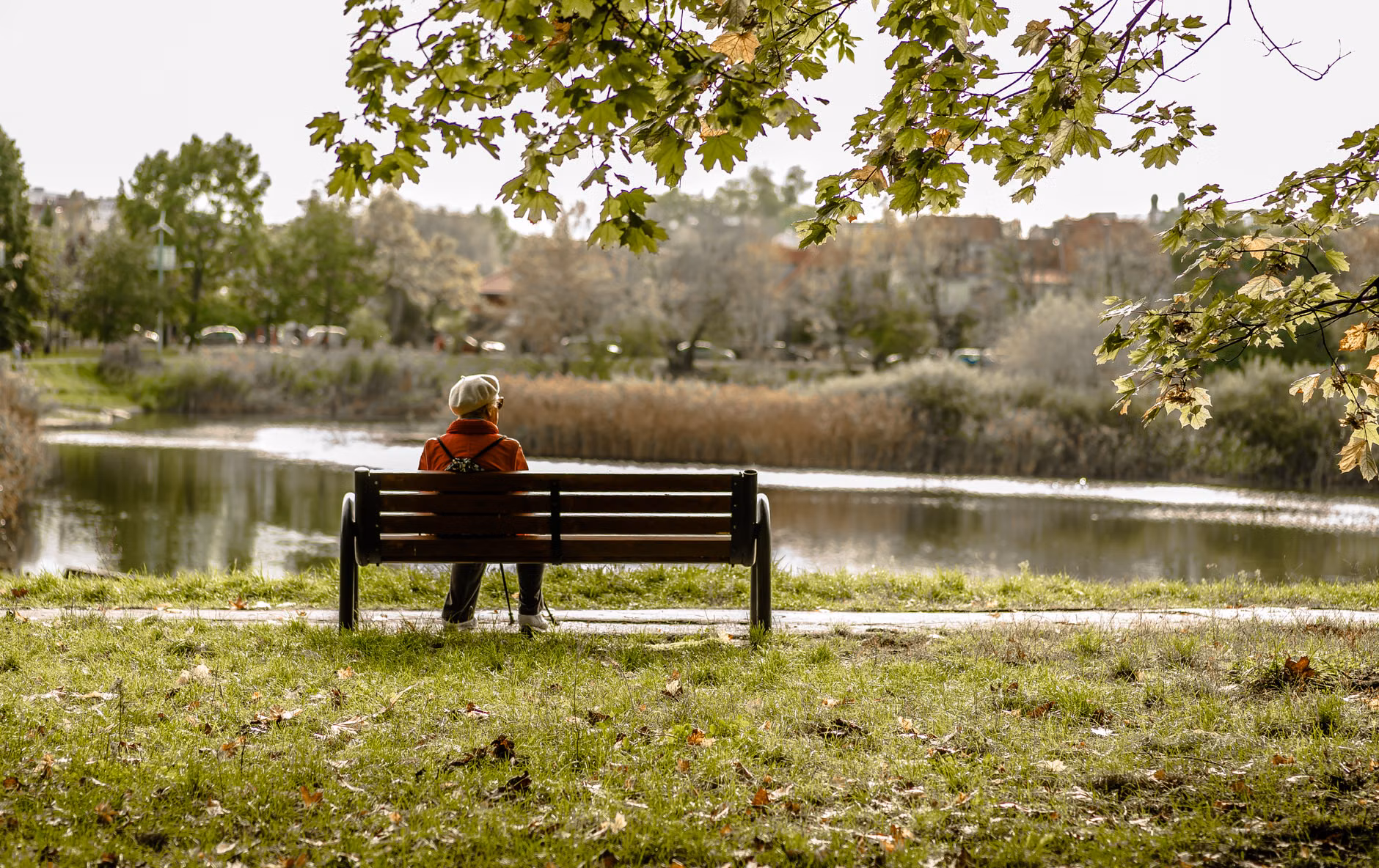 A person reflecting in a quiet park space.