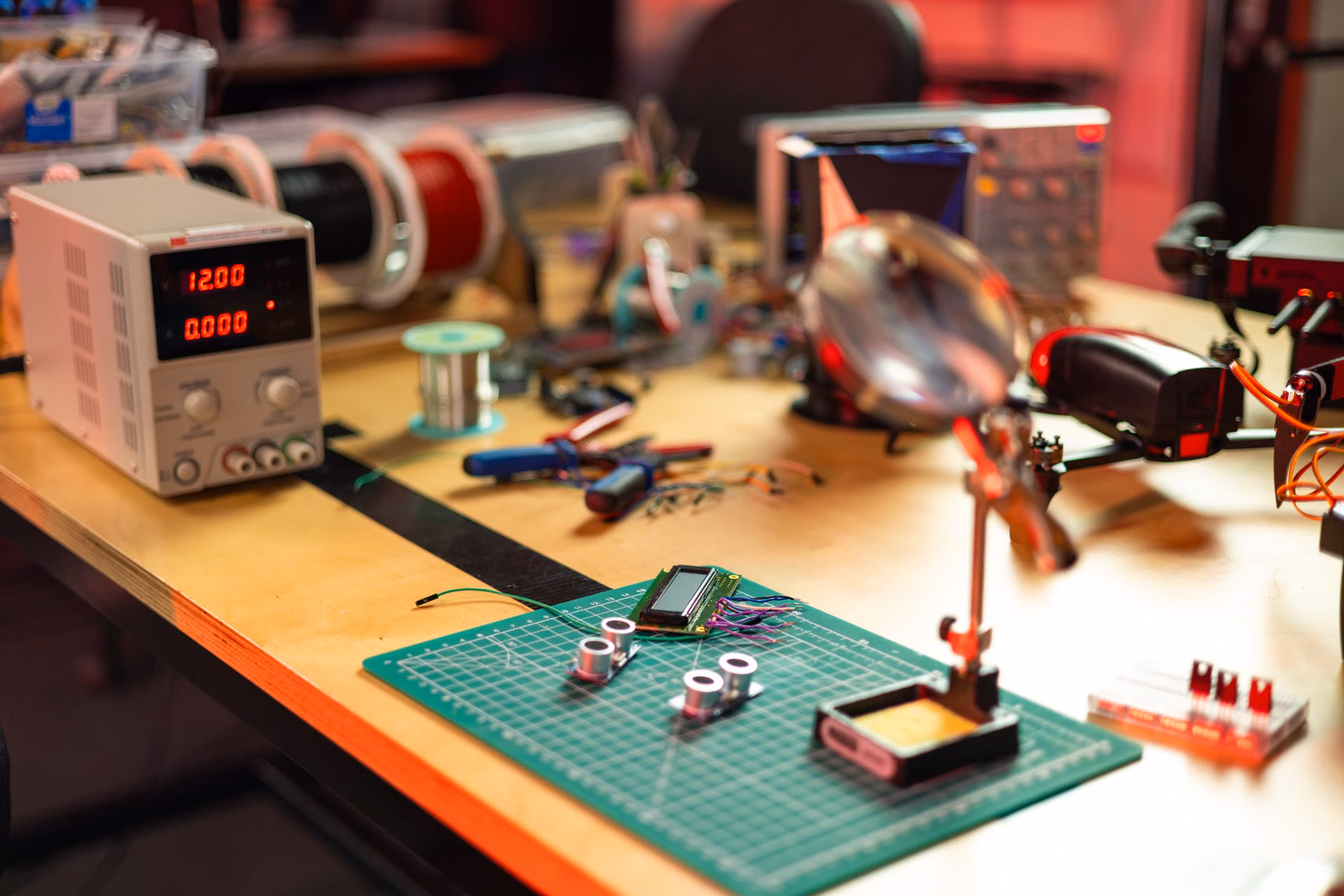 An organized tech workspace showing electronic components undergoing quality testing.