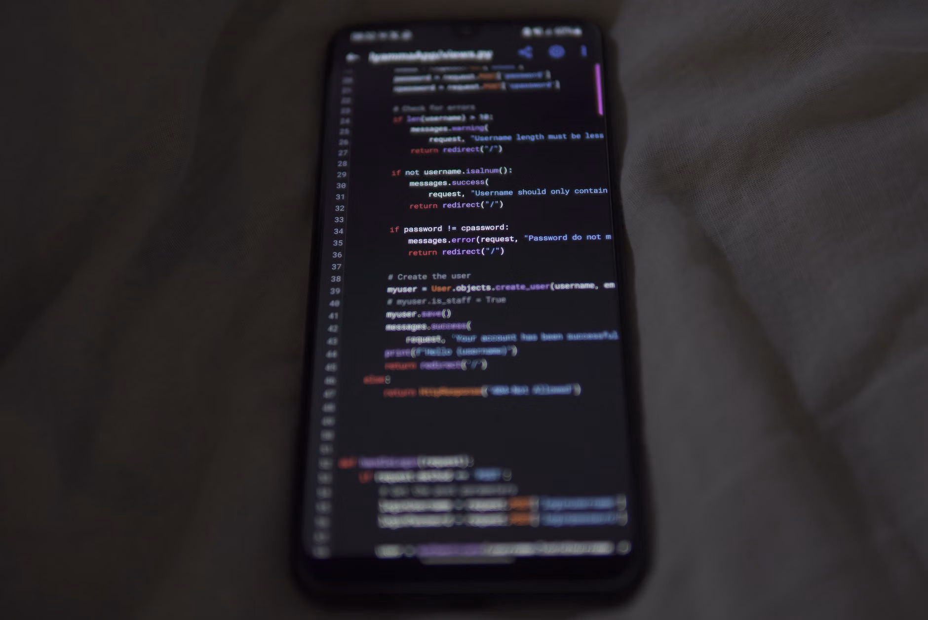 Close-up of a smartphone screen showing a color-coded shared weekly schedule.
