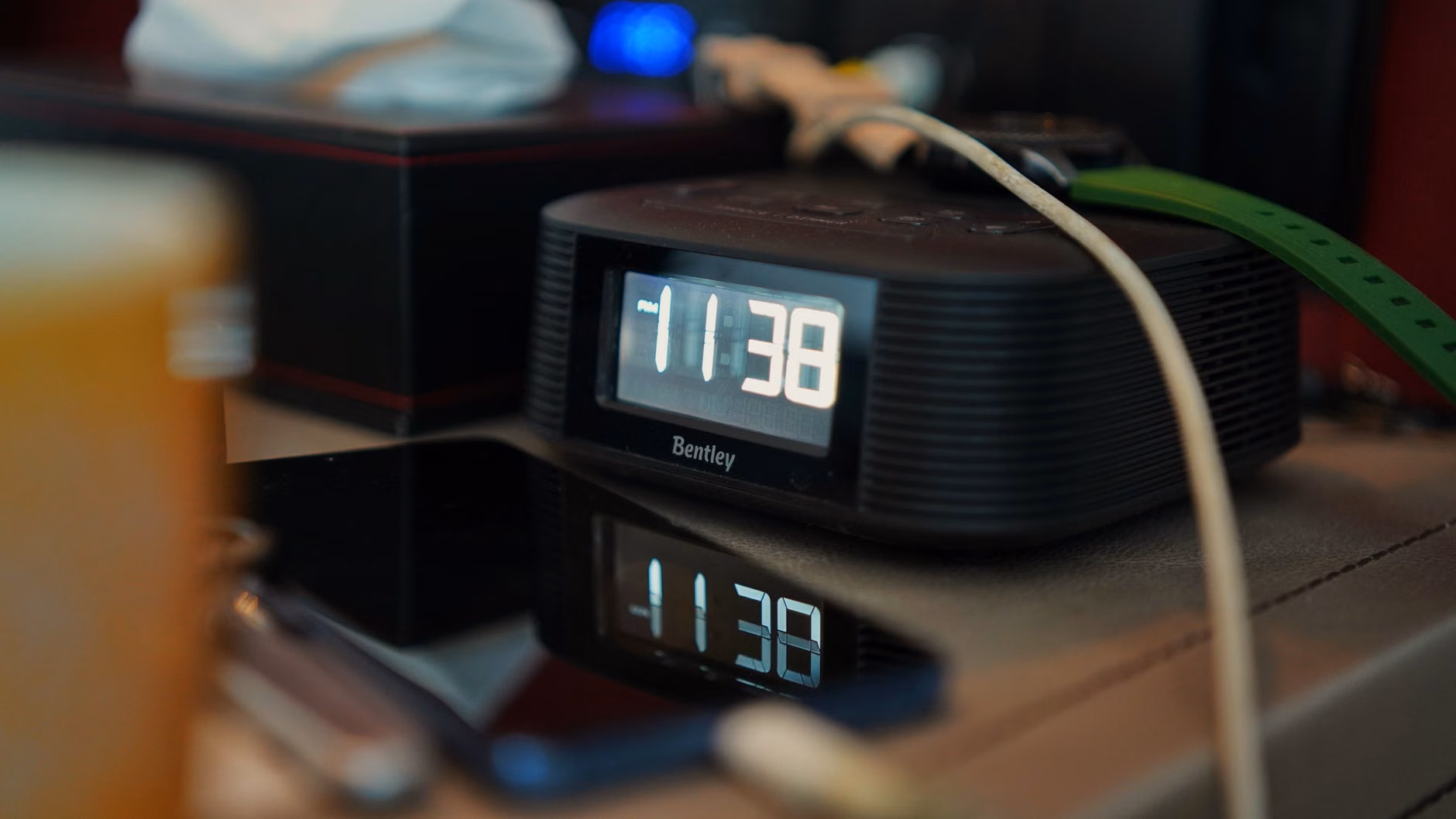 A bedside table featuring a dedicated alarm clock to replace smartphone usage.