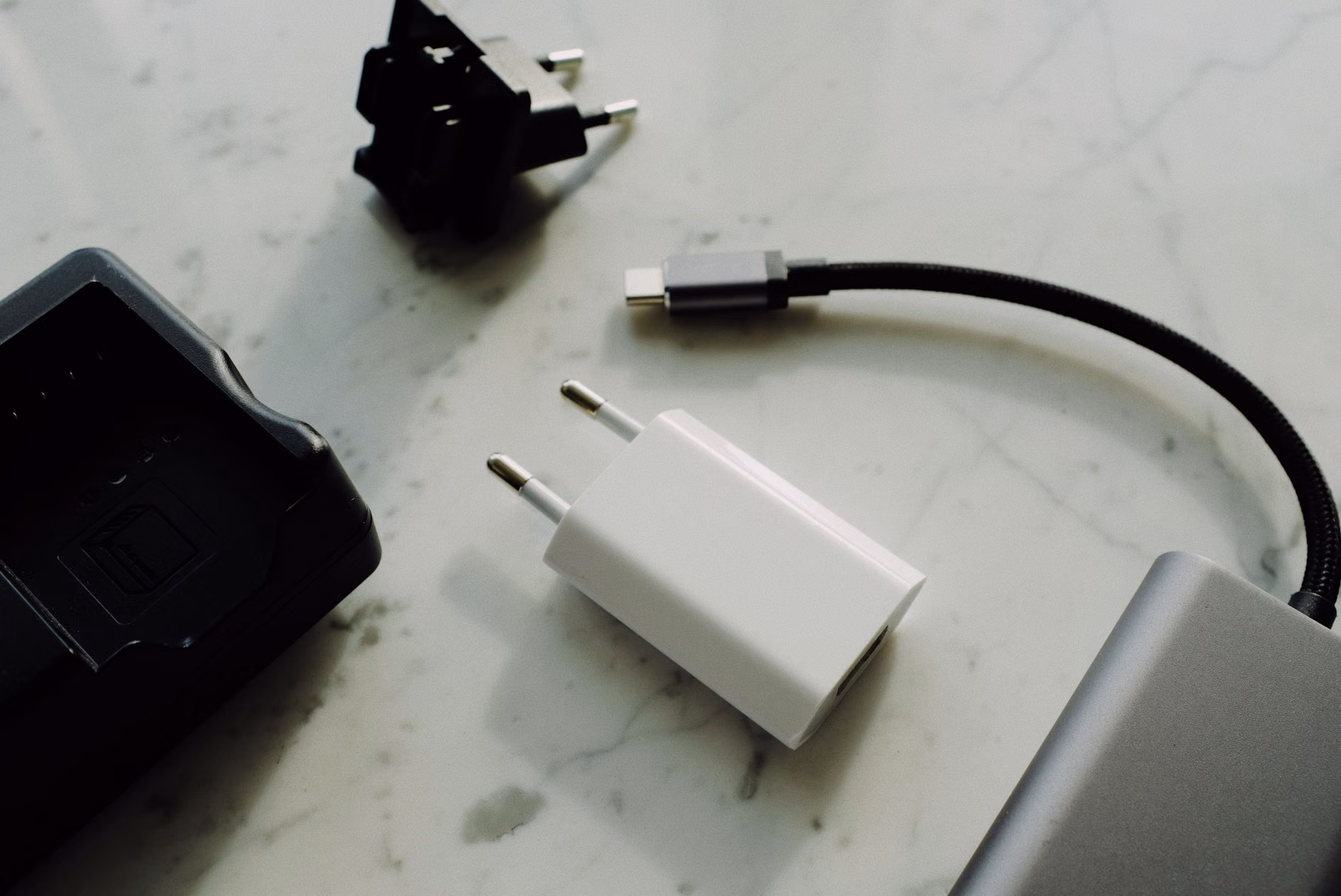 Multiple family devices charging simultaneously from a single high-wattage power hub.