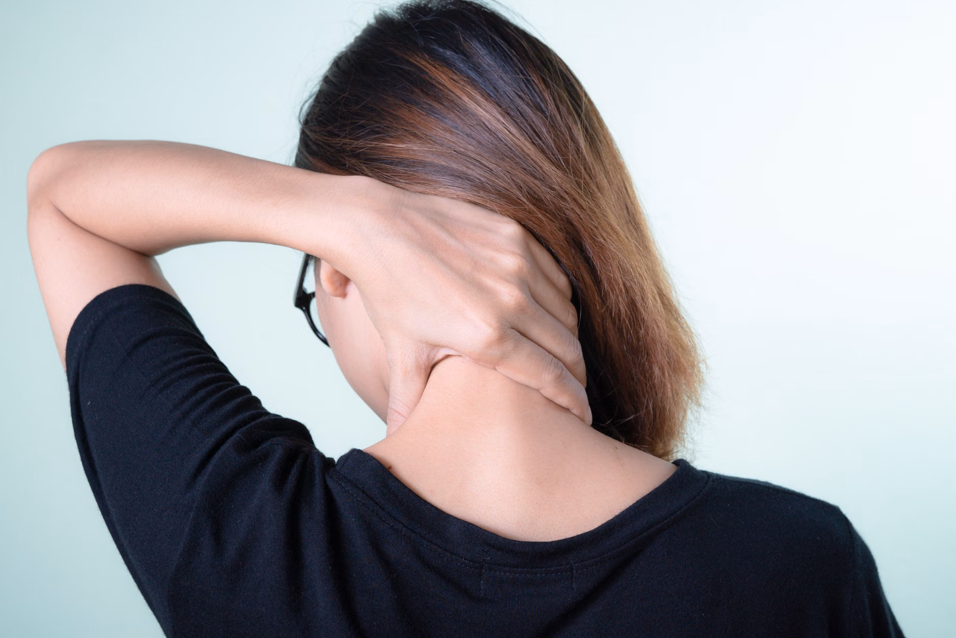 Simple stretches to relieve neck and shoulder tension at a desk.