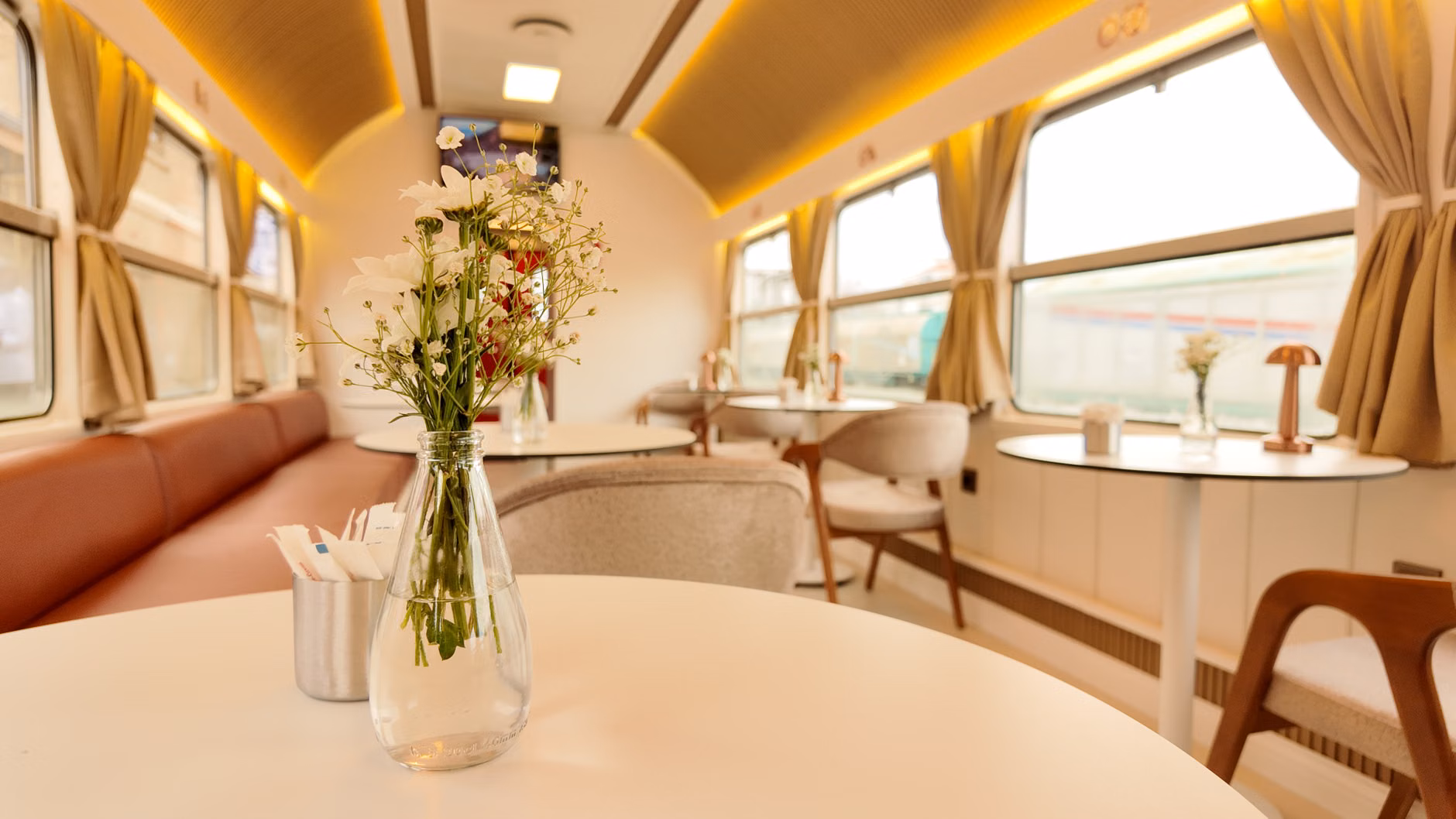 Interior view of a comfortable, productive train carriage for family travel.