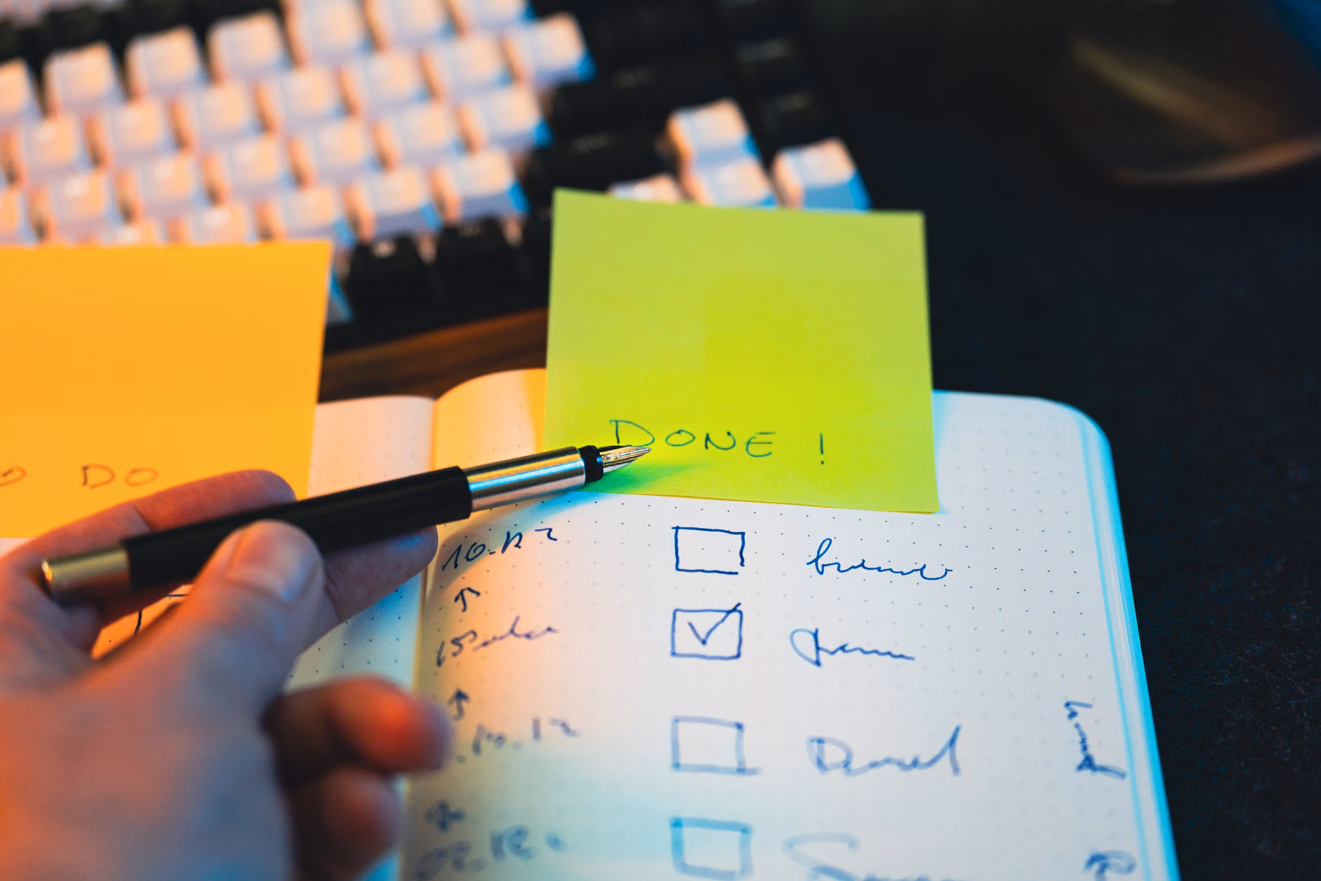 A notebook and pen used for tracking progress in personal development.