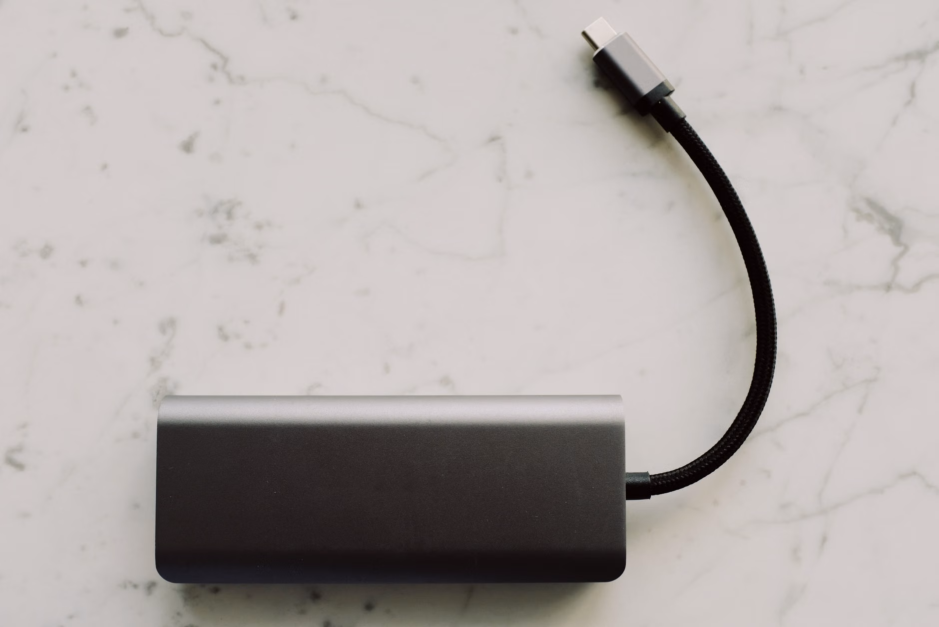 Conceptual illustration of multiple devices sharing a single USB-C power delivery cable.