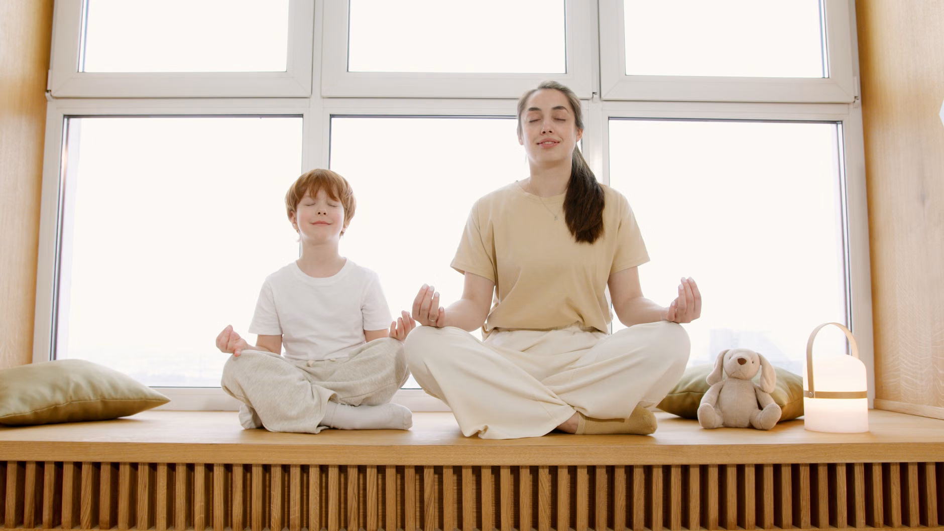 A parent practicing self-care and mindful breathing to reset their own nervous system in the evening.