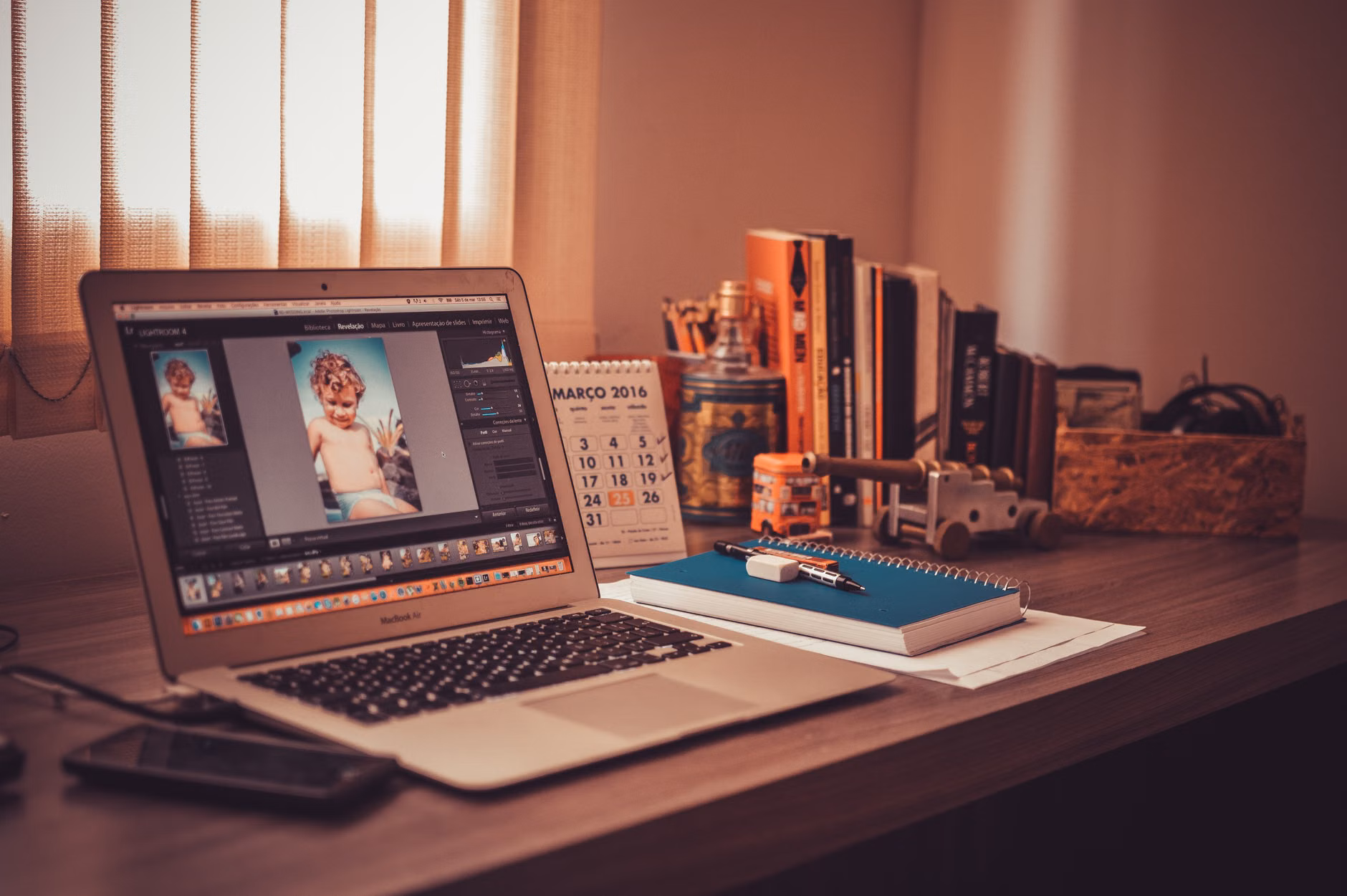 A parent productively organizing family photos on a computer.