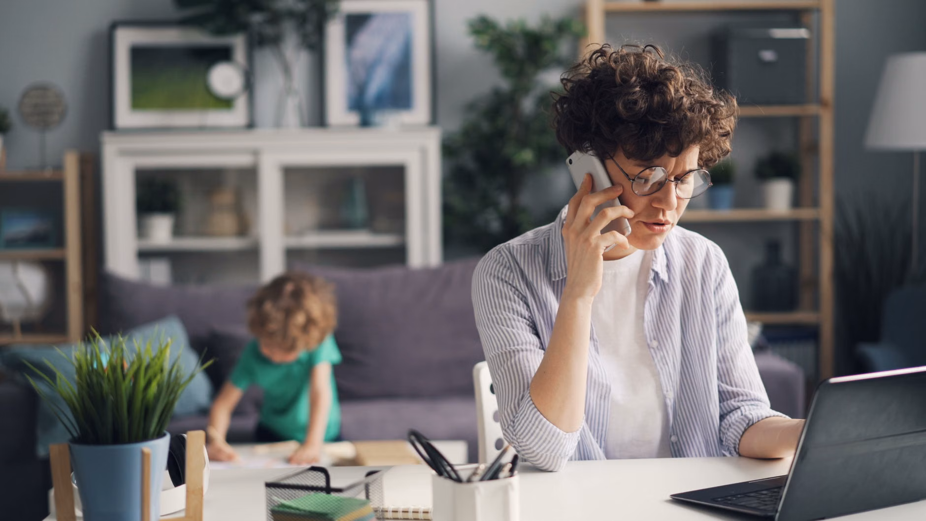 A parent working efficiently in a community-focused, accessible workspace.