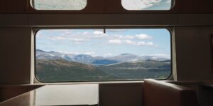 A scenic view from a train window during a relaxing day trip.