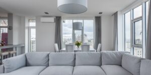 A bright living room featuring a versatile modular sofa setup.