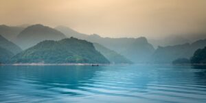 A serene, misty landscape representing the essence of Quiet Travel.