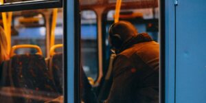 A calm professional enjoying a quiet moment on their commute.