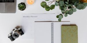 A minimalist desk setup with analog tools like a journal and fountain pen.