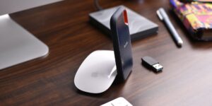 A modern home office setup with a personal storage device.