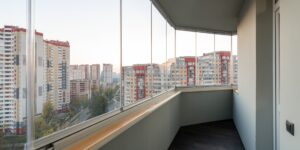 A cozy, modern city balcony at sunset during a family staycation.